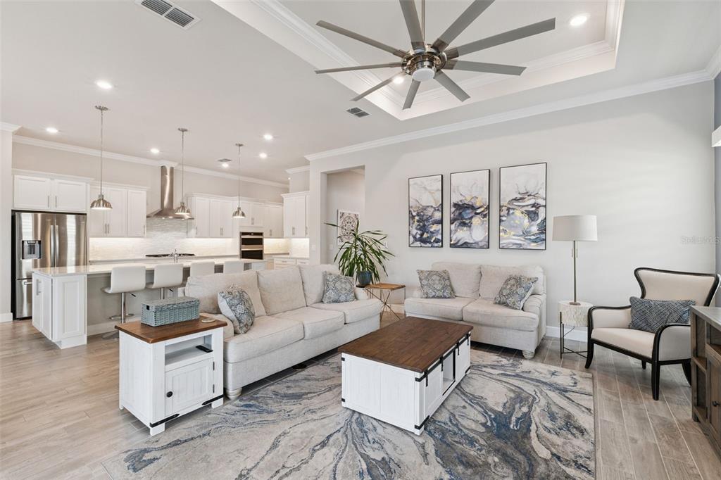 2745 Nature Vw Road St. Cloud, FL 34771 - Photo 3 of 50 a living room with furniture and a view of kitchen