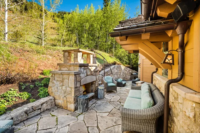 a front view of a house with outdoor seating