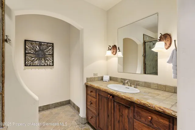 a bedroom with bed and walk in closet