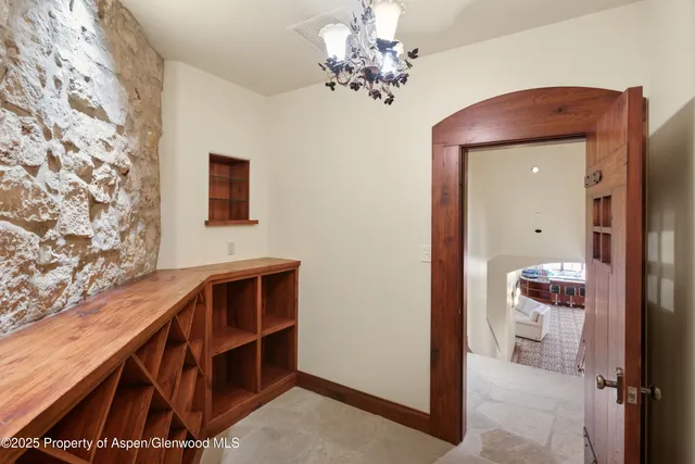 a room with furniture a rug and a window