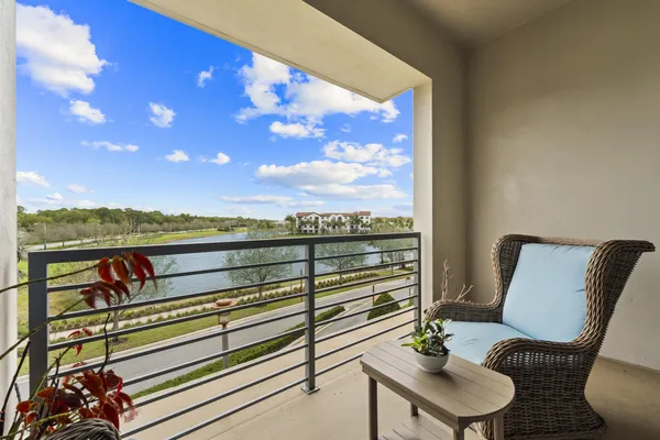 a view of a balcony with chairs