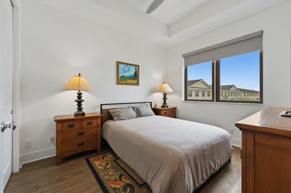 a bedroom with a bed and a table