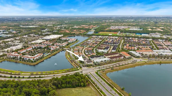 an aerial view of residential houses with outdoor space