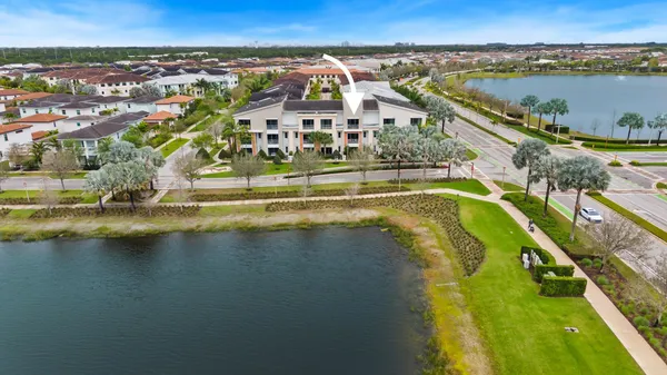 a view of residential houses with outdoor space and lake view