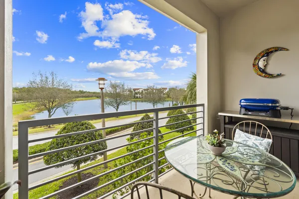 a view of a balcony with table and chairs