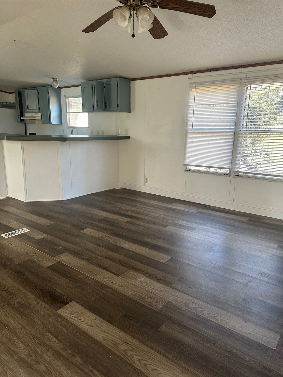 18759 Fire Fly Drive Porter, TX 77365 - Photo 4 of 11 an empty room with wooden floor and windows