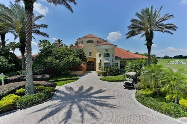 a front view of a house with garden and porch