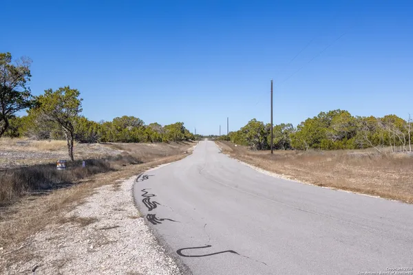 a view of a road with a yard