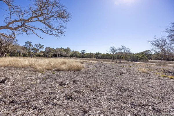 a view of a lake with houses in the back