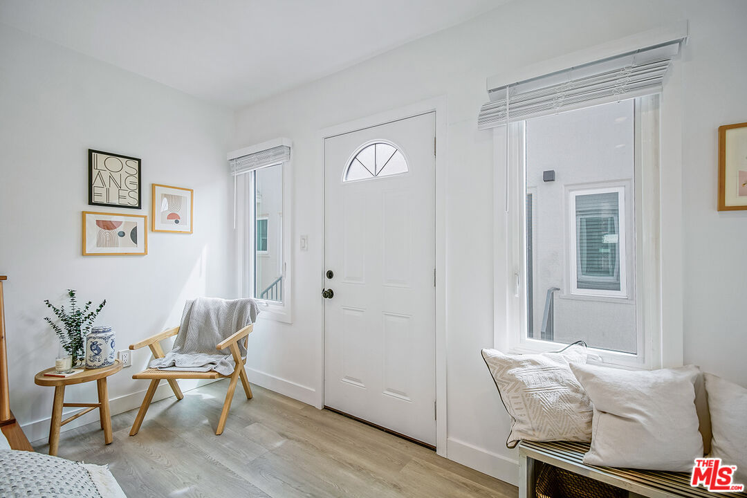 1217 9th Street, Unit 9 Santa Monica, CA 90401 - Photo 5 of 14 a living room with furniture and wooden floor
