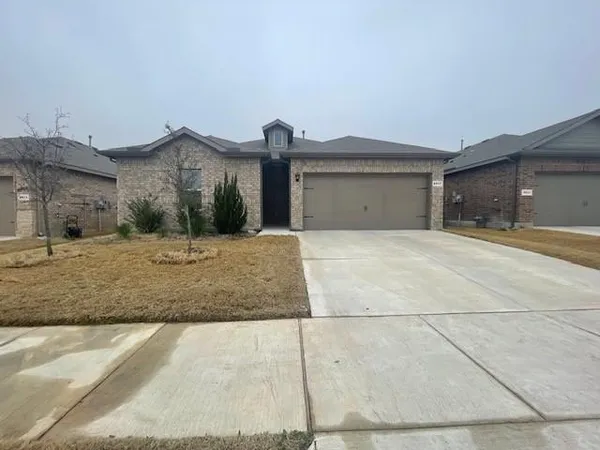 a view of yellow house with a outdoor space