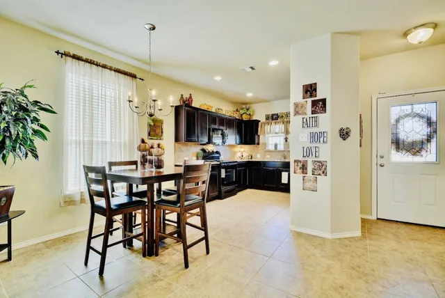 a view of a dining room kitchen and a window