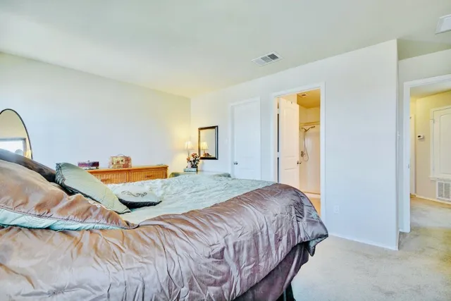 a bedroom with bed and window