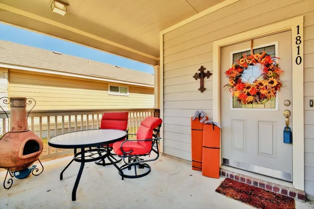 a room with furniture and a potted plant