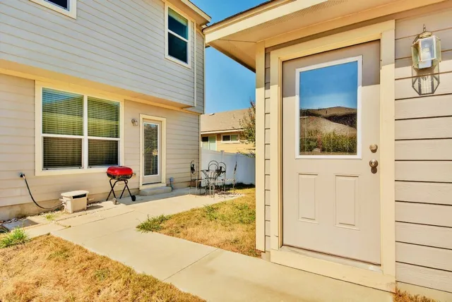 a view of a bathroom with a tub and window