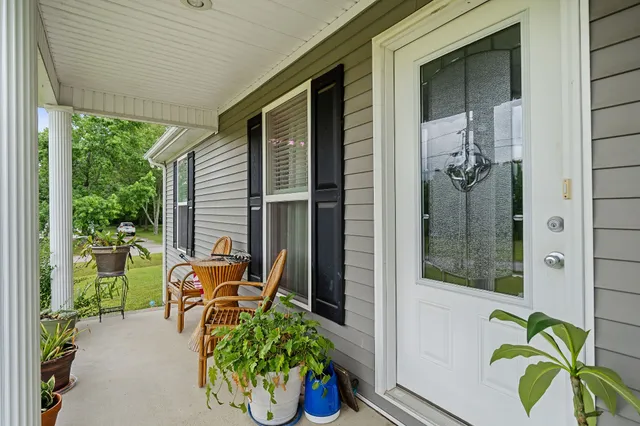 a backyard of a house with outdoor seating