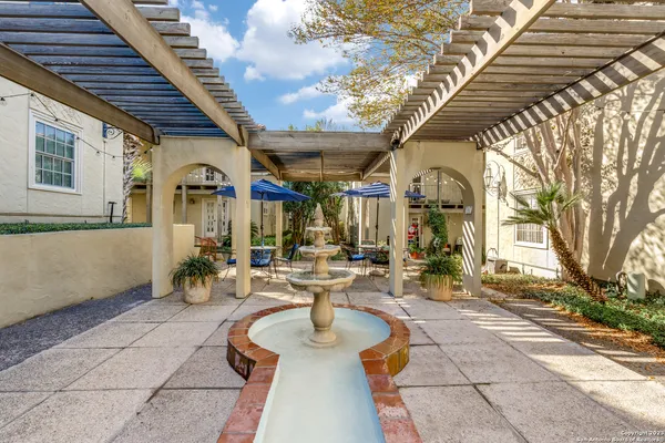 a view of swimming pool with outdoor seating