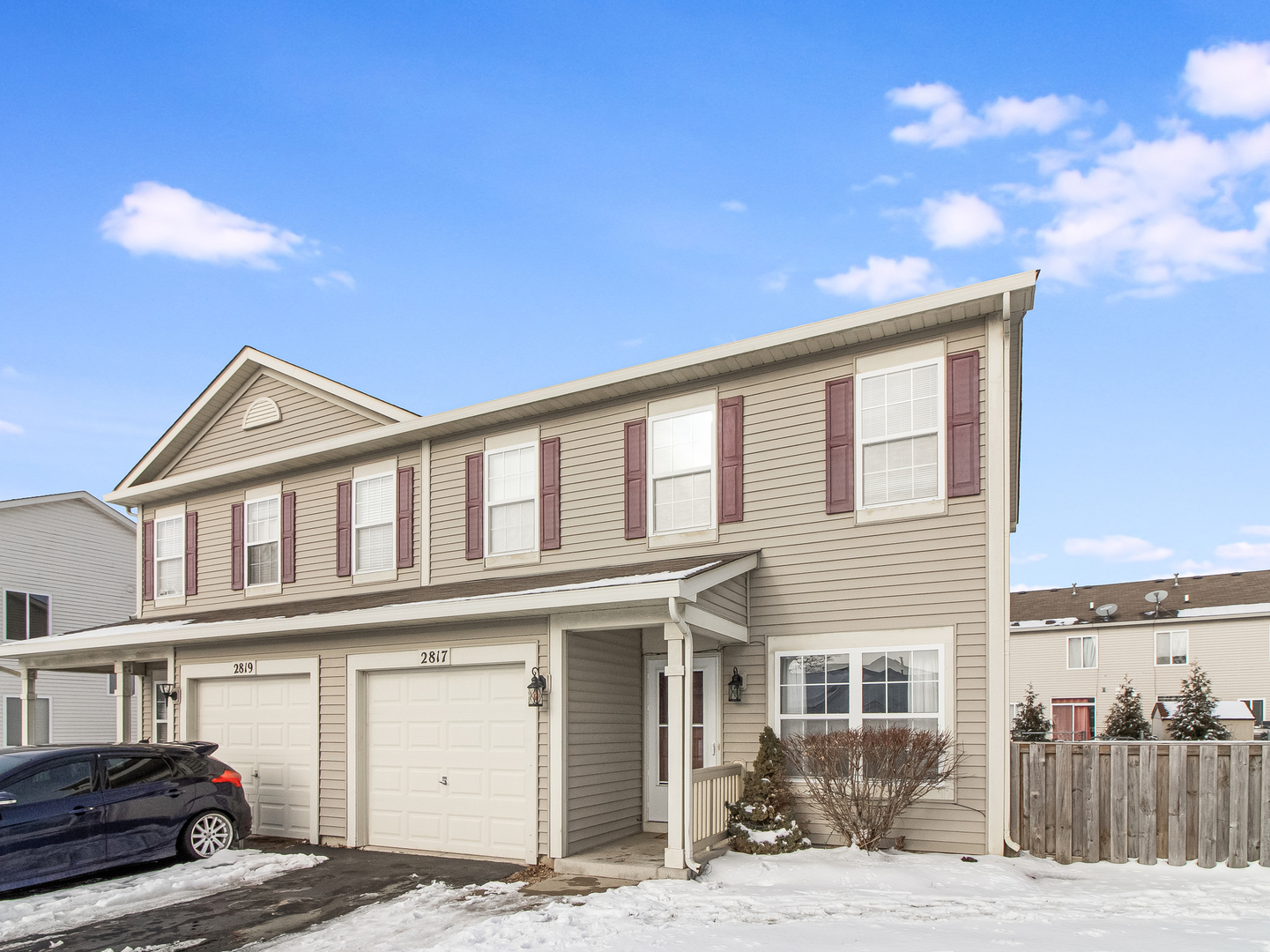 2817 Hoffman Street Plano, IL 60545 - Photo 1 of 25 a front view of a house with a yard