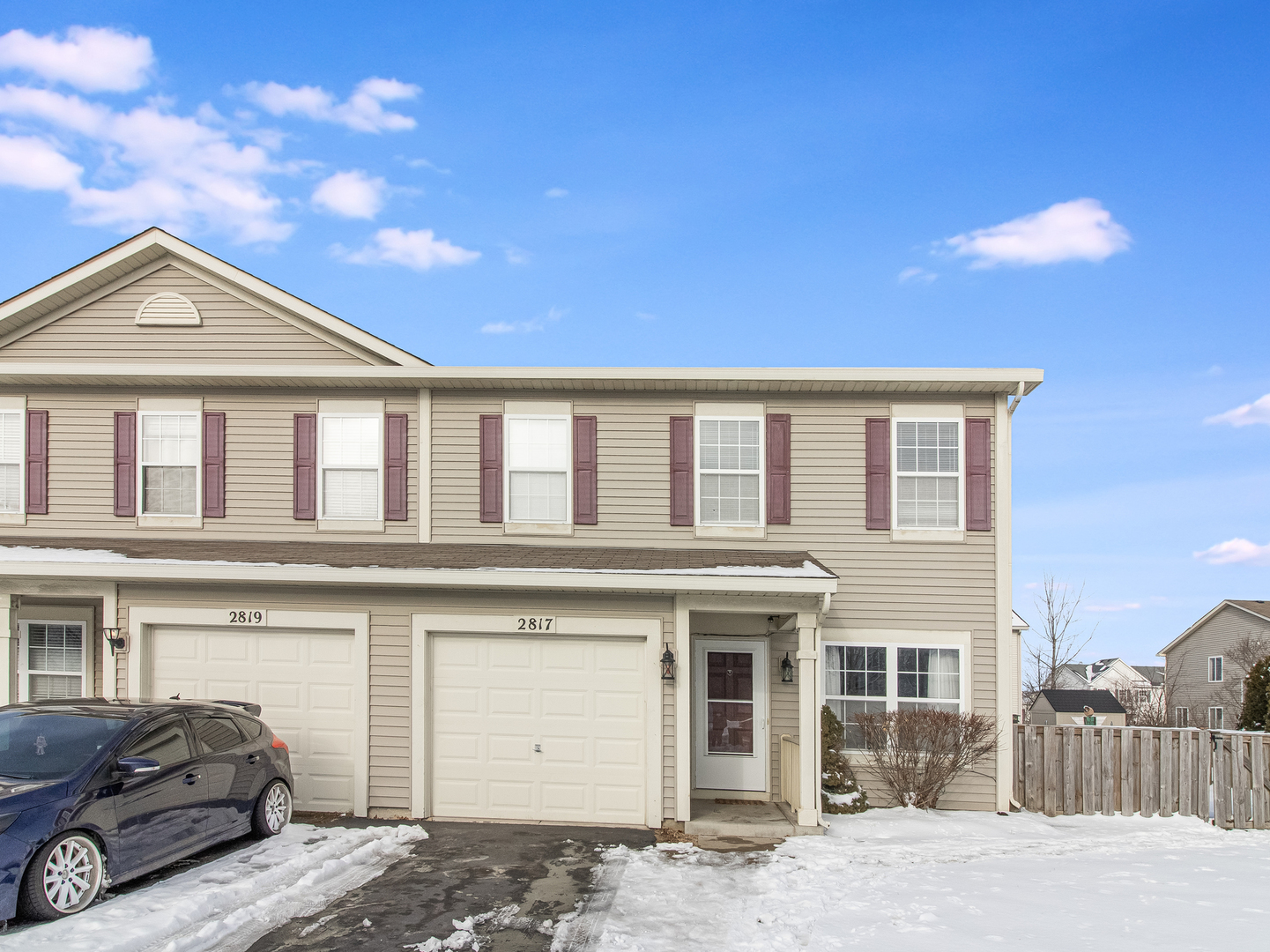 2817 Hoffman Street Plano, IL 60545 - Photo 2 of 25 a view of a house with a parking space