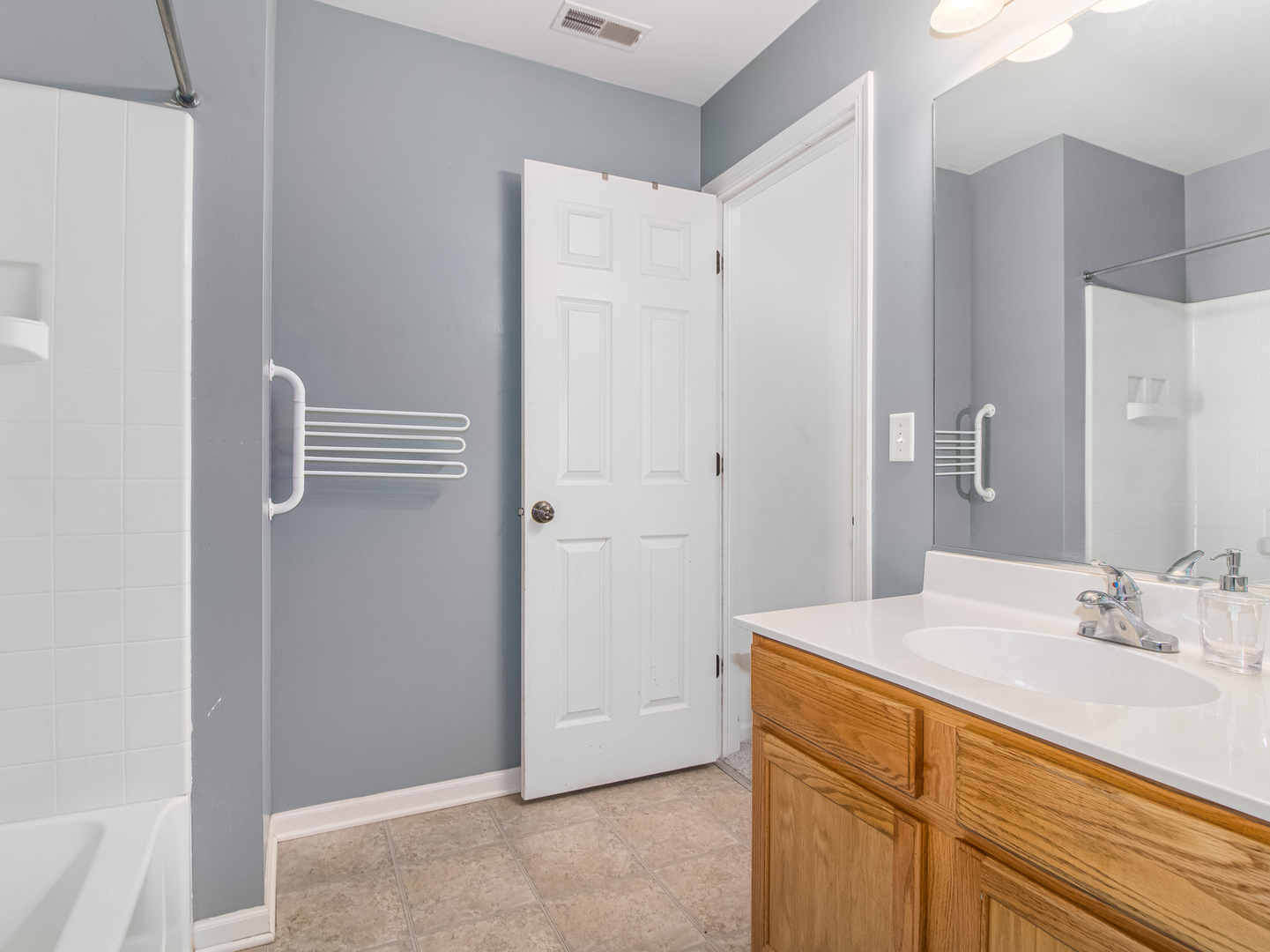 2817 Hoffman Street Plano, IL 60545 - Photo 15 of 25 a bathroom with a sink and a mirror