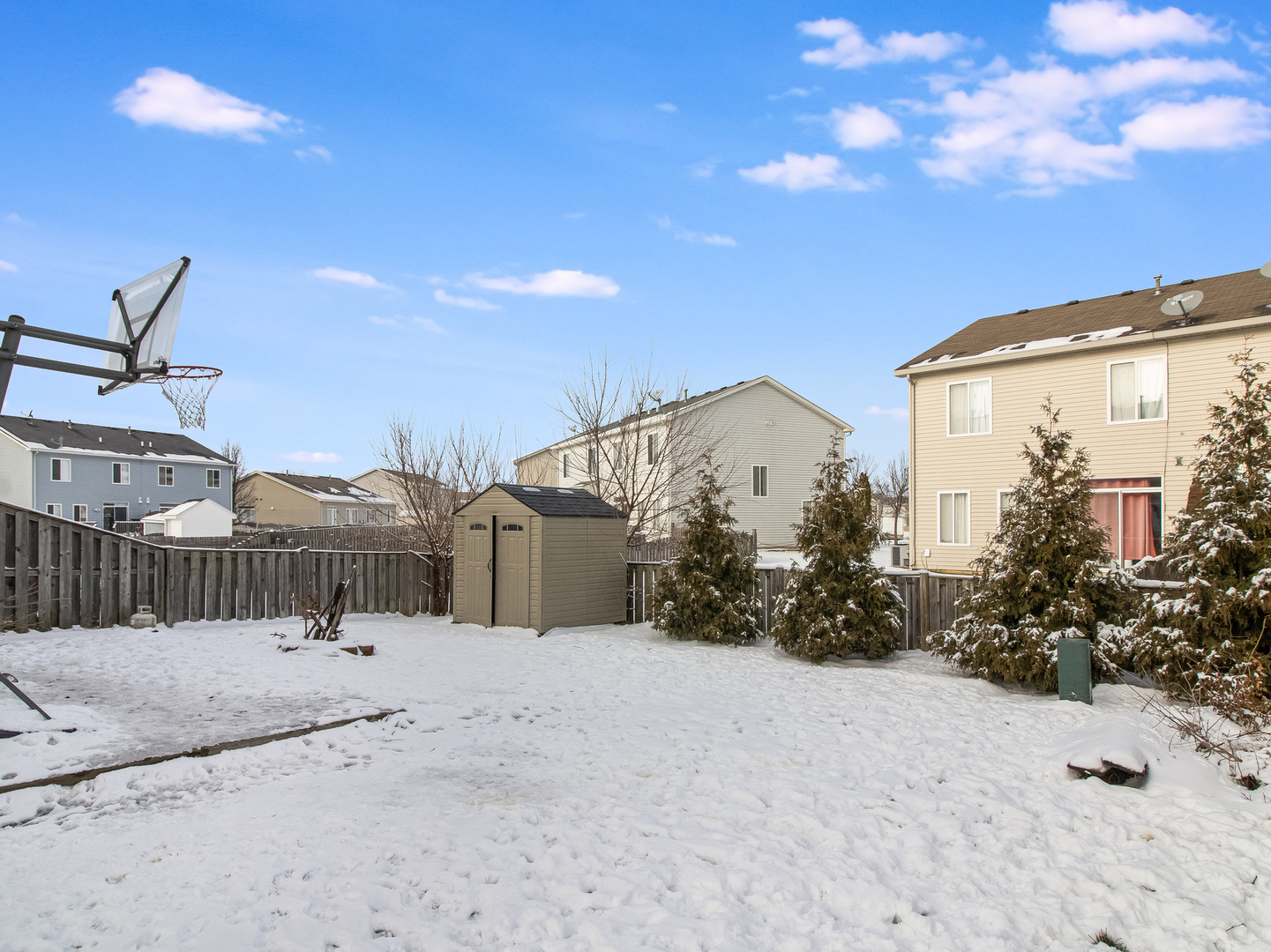 2817 Hoffman Street Plano, IL 60545 - Photo 5 of 25 a view of a house with a snow in the yard