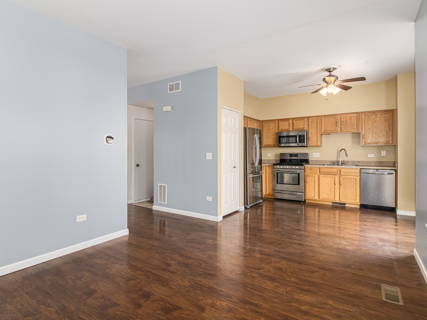 2817 Hoffman Street Plano, IL 60545 - Photo 7 of 25 a view of a kitchen with a sink and a stove top oven