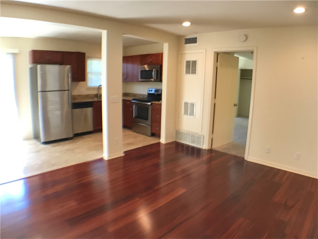 2800 Cole Street, Unit 206C Austin, TX 78705 - Photo 5 of 12 a view of kitchen view wooden floor and electronic appliances
