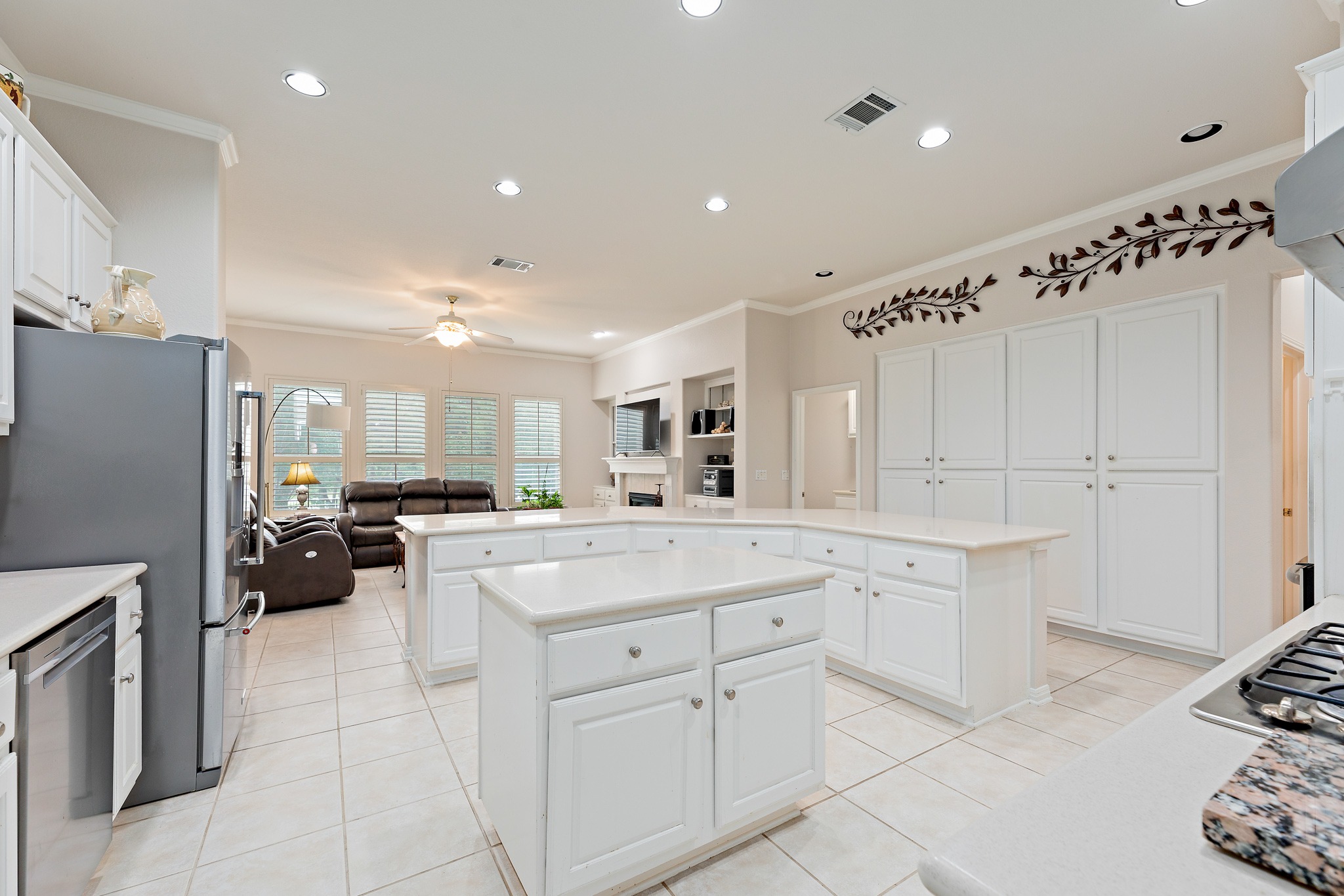 106 Wild Turkey Lane Georgetown, TX 78633 - Photo 10 of 39 a kitchen with white cabinets and appliances