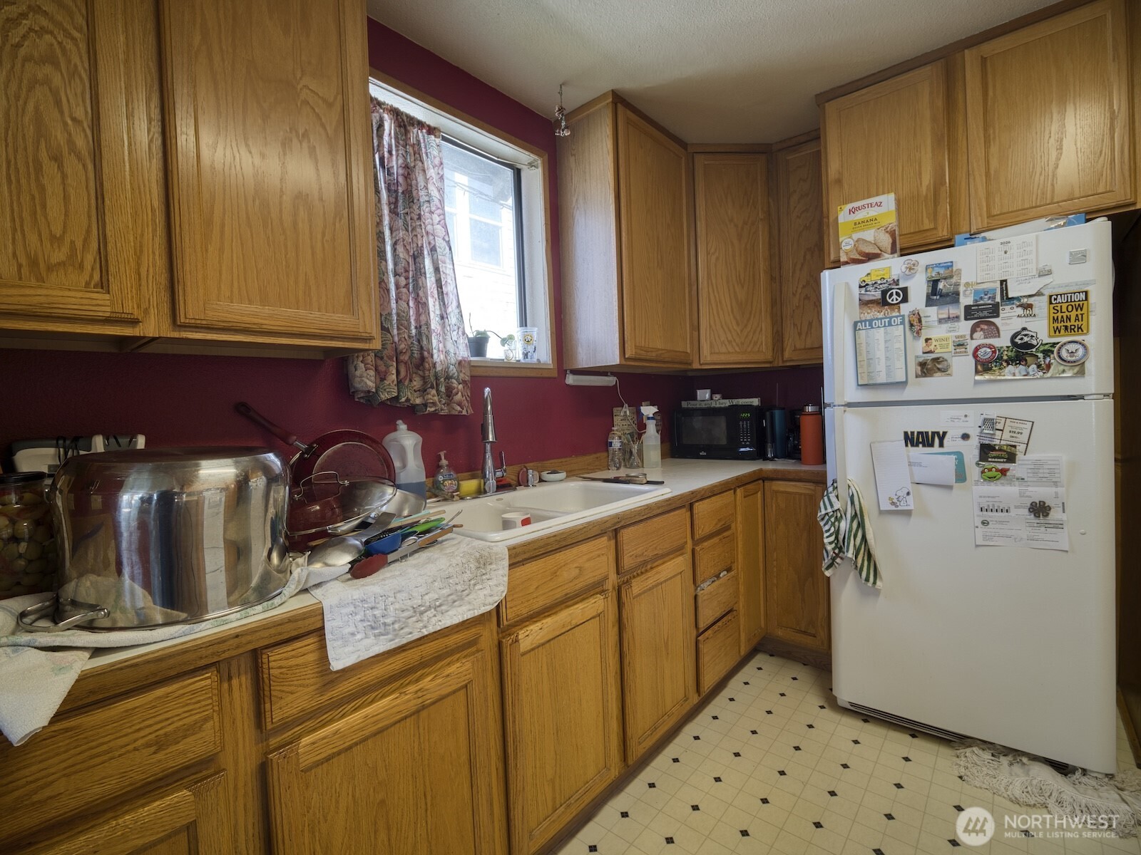620 Monroe Street Hoquiam, WA 98550 - Photo 4 of 8 a kitchen with a refrigerator and a sink