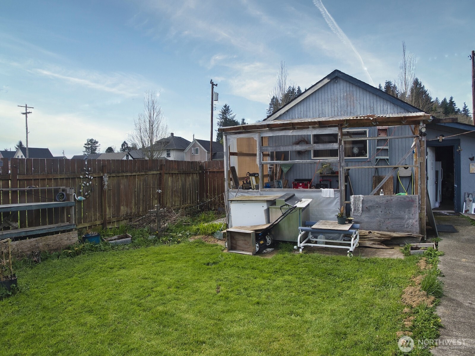 620 Monroe Street Hoquiam, WA 98550 - Photo 8 of 8 a view of a chair and table in backyard of the house