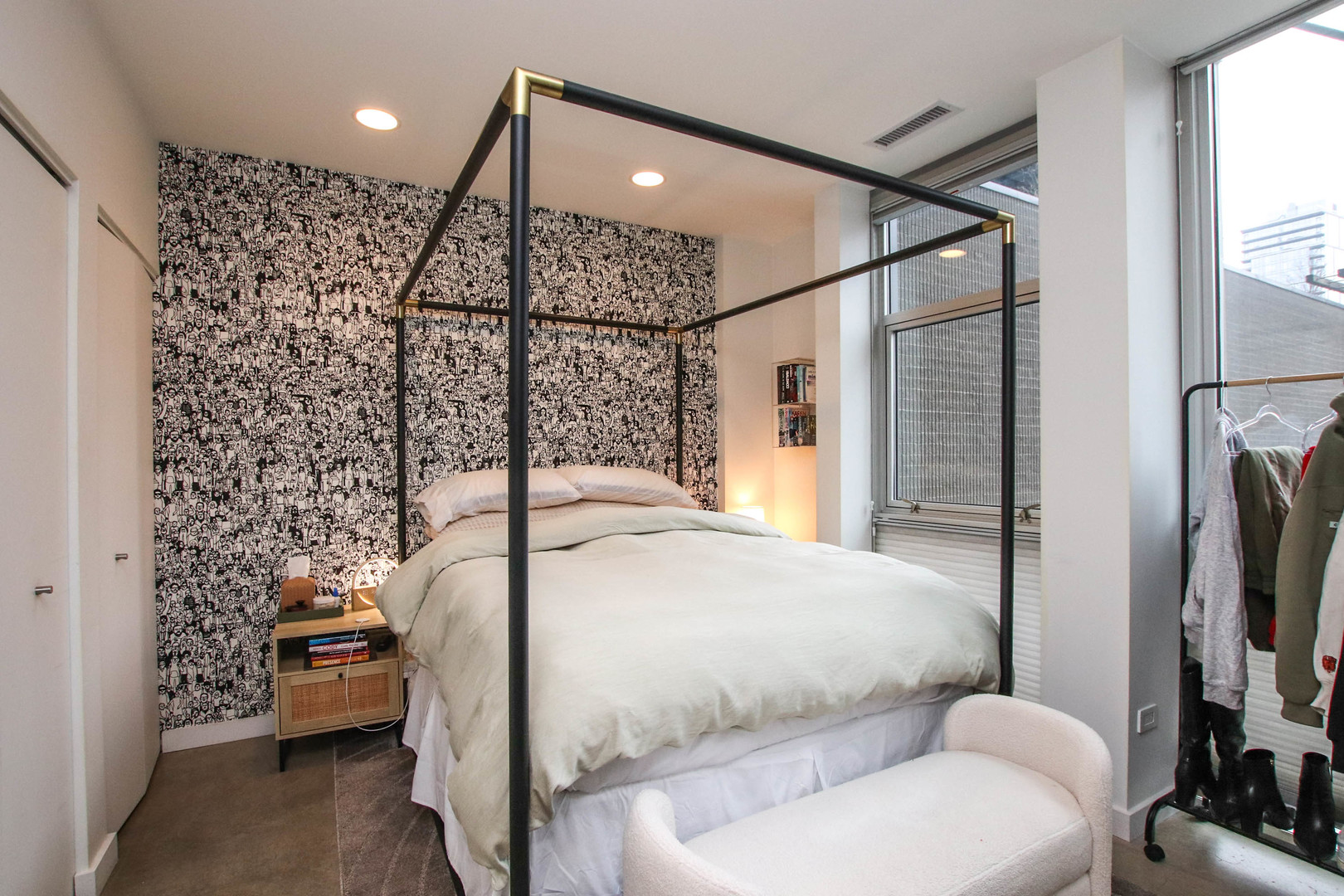 156 West Superior Street, Unit 302 Chicago, IL 60654 - Photo 13 of 17 a bedroom with a bed and a flat screen tv