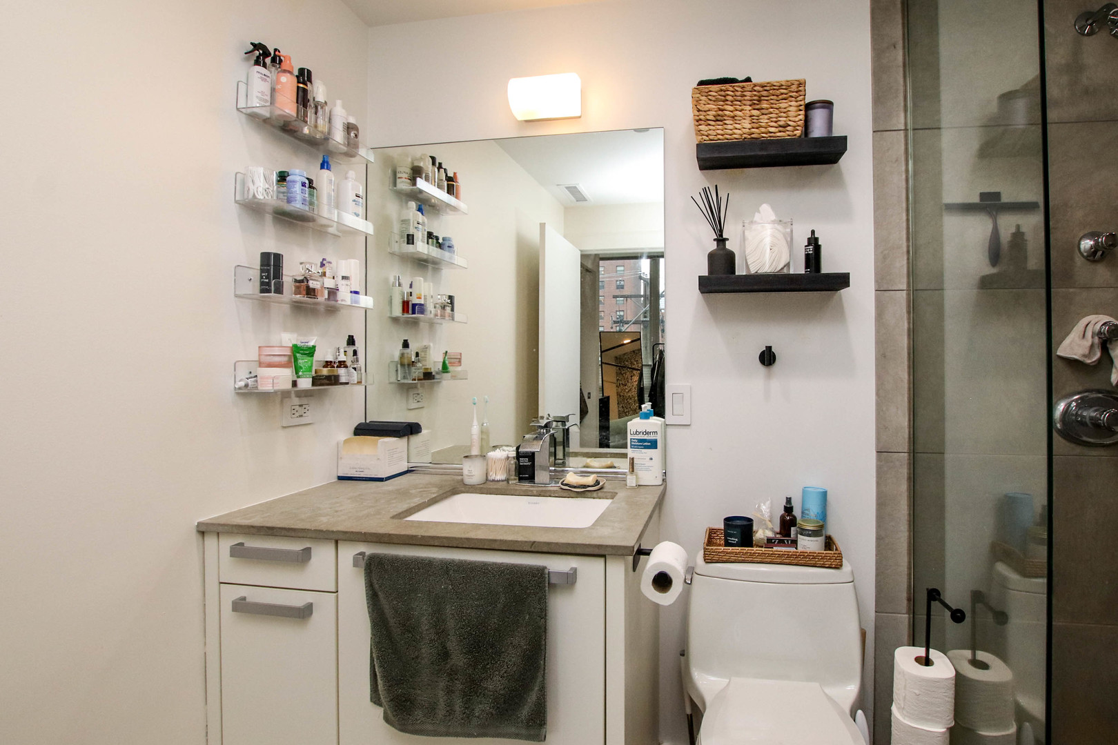 156 West Superior Street, Unit 302 Chicago, IL 60654 - Photo 15 of 17 a utility room with stainless steel appliances a sink and a refrigerator