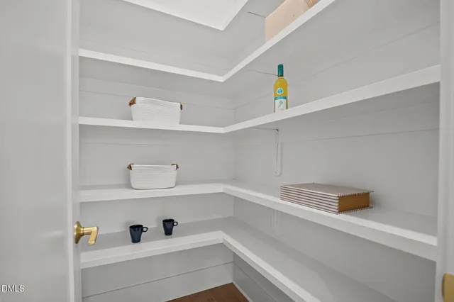 a living room with furniture fireplace and a table