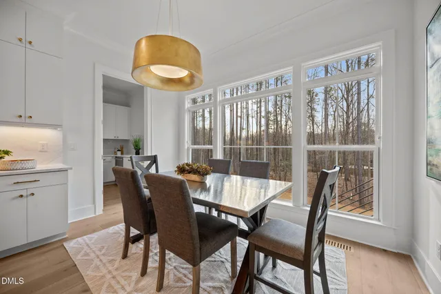 a bed room with a bed and chair