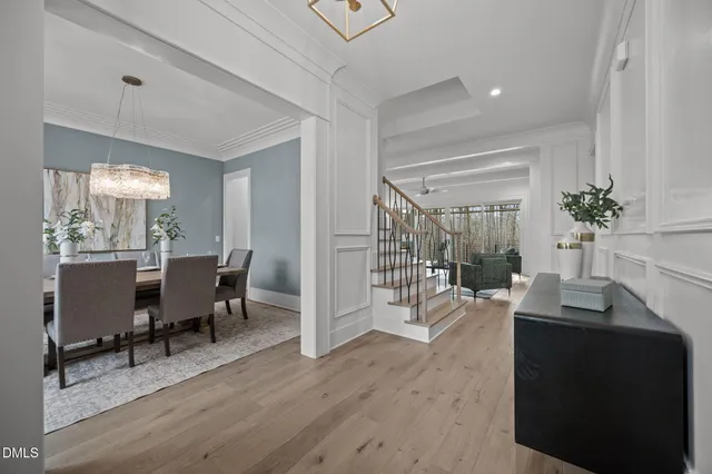 a kitchen with white cabinets appliances and sink