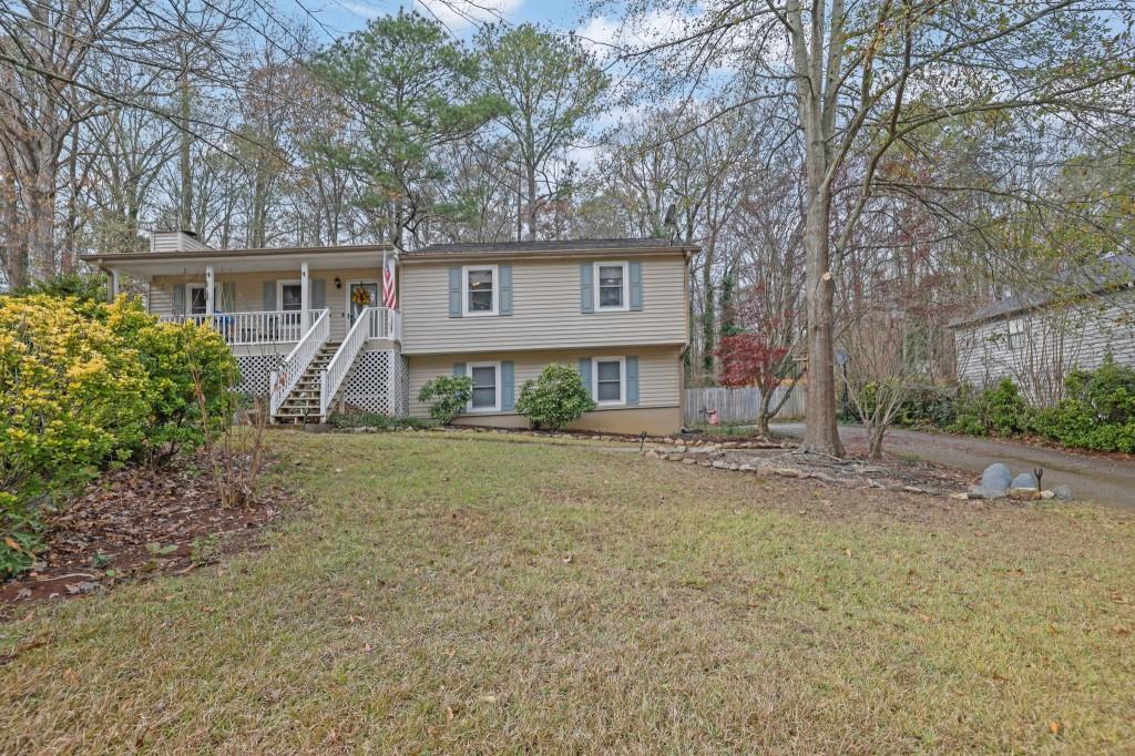 4370 Conwhey Court Southwest Smyrna, GA 30082 - Photo 1 of 1 a view of a house with a yard and large tree