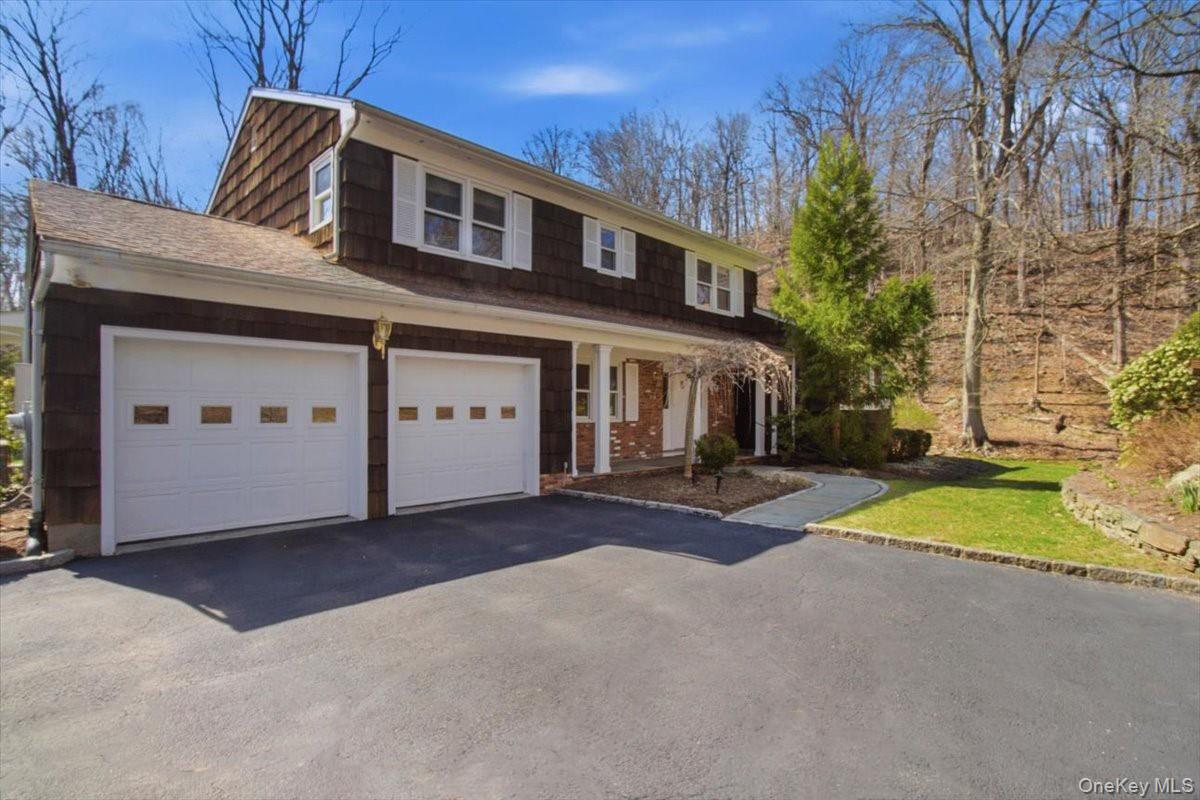 73 Cedar Hill Road Bedford, NY 10506 - Photo 1 of 33 a view of a house with a yard and garage
