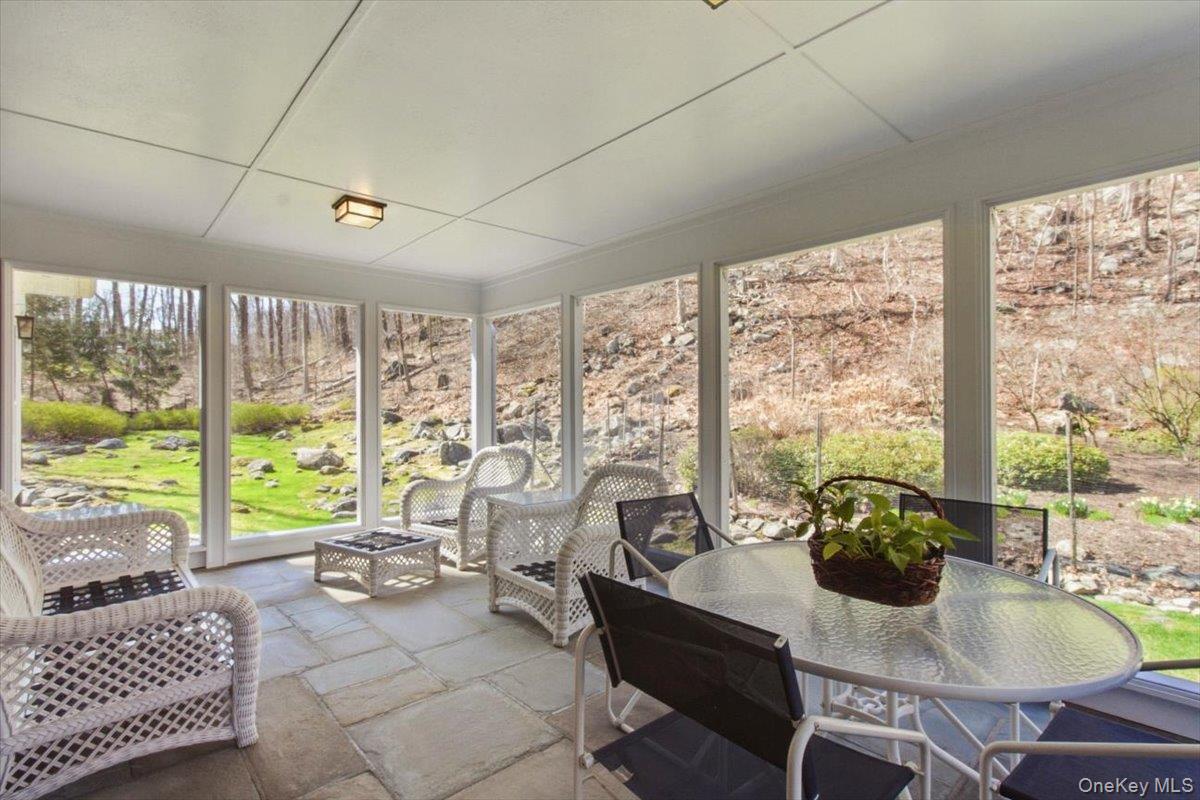 73 Cedar Hill Road Bedford, NY 10506 - Photo 16 of 33 a living room with furniture and a large window
