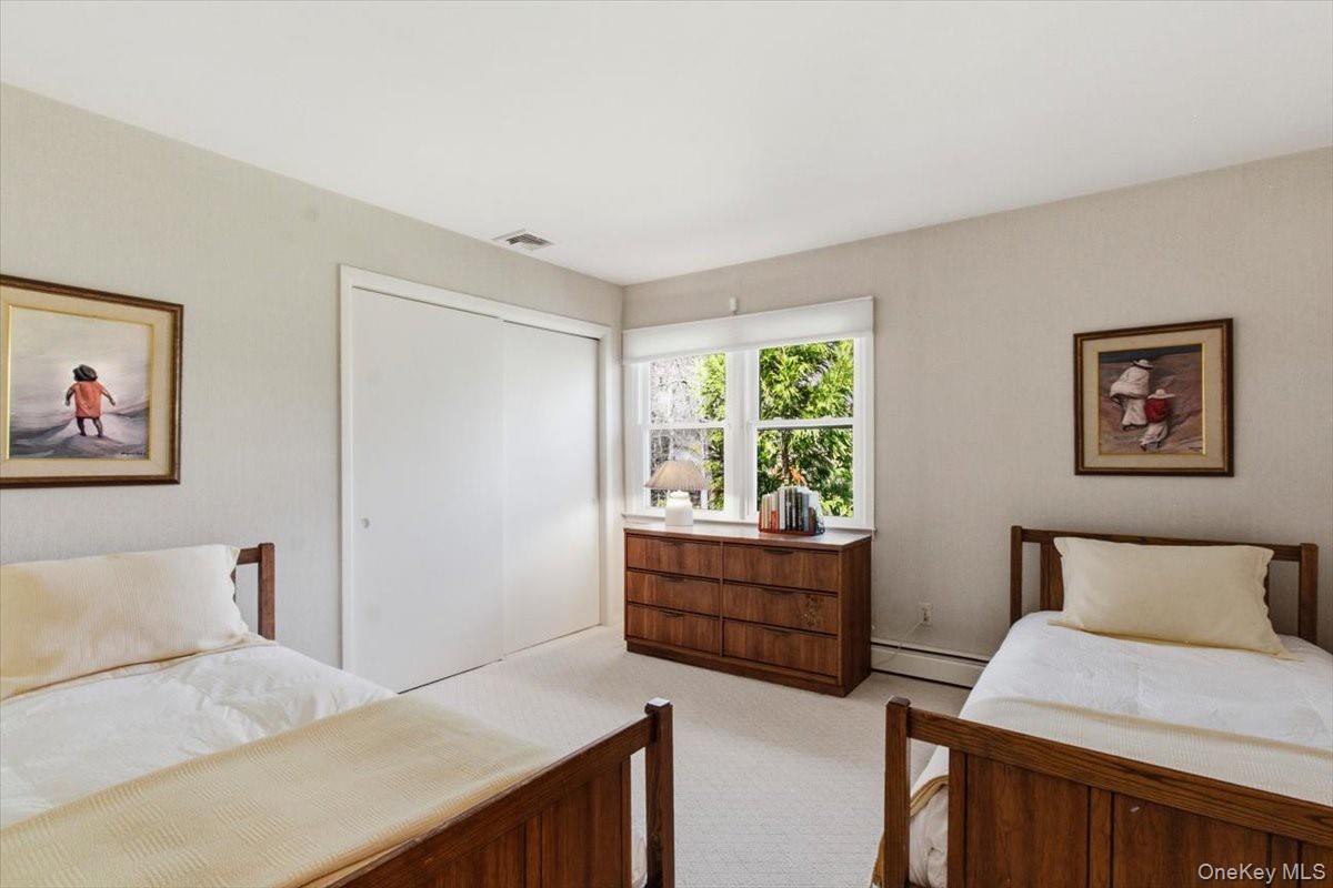 73 Cedar Hill Road Bedford, NY 10506 - Photo 21 of 33 a bedroom with furniture and window