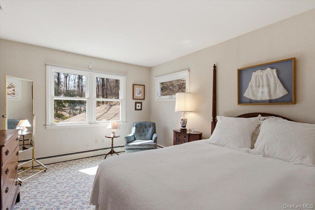 73 Cedar Hill Road Bedford, NY 10506 - Photo 22 of 33 a bedroom with a large bed and a window