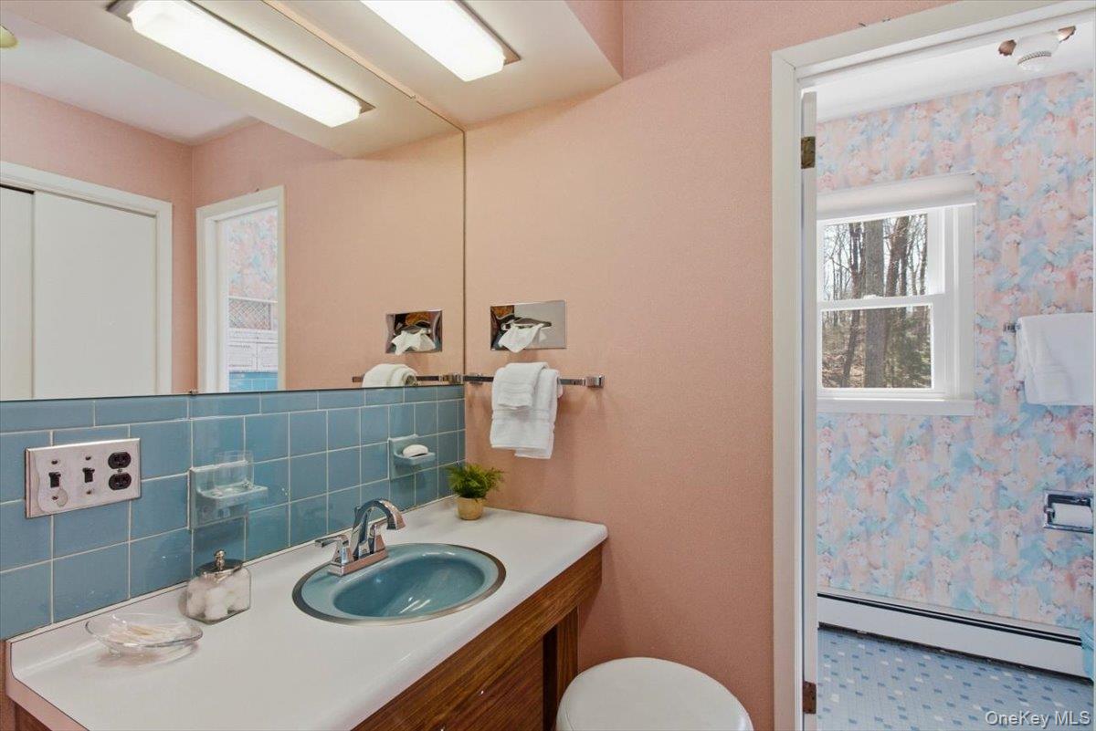 73 Cedar Hill Road Bedford, NY 10506 - Photo 25 of 33 a bathroom with a sink toilet and mirror