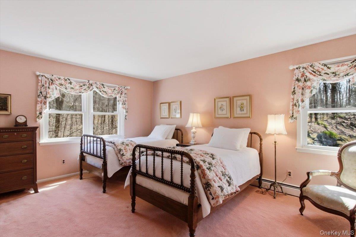 73 Cedar Hill Road Bedford, NY 10506 - Photo 26 of 33 a bedroom with a bed chair and a window