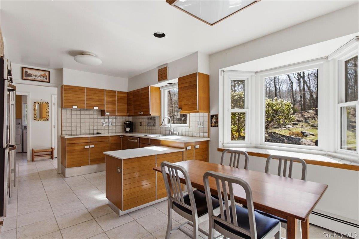 73 Cedar Hill Road Bedford, NY 10506 - Photo 7 of 33 a kitchen with stainless steel appliances granite countertop a sink and a refrigerator
