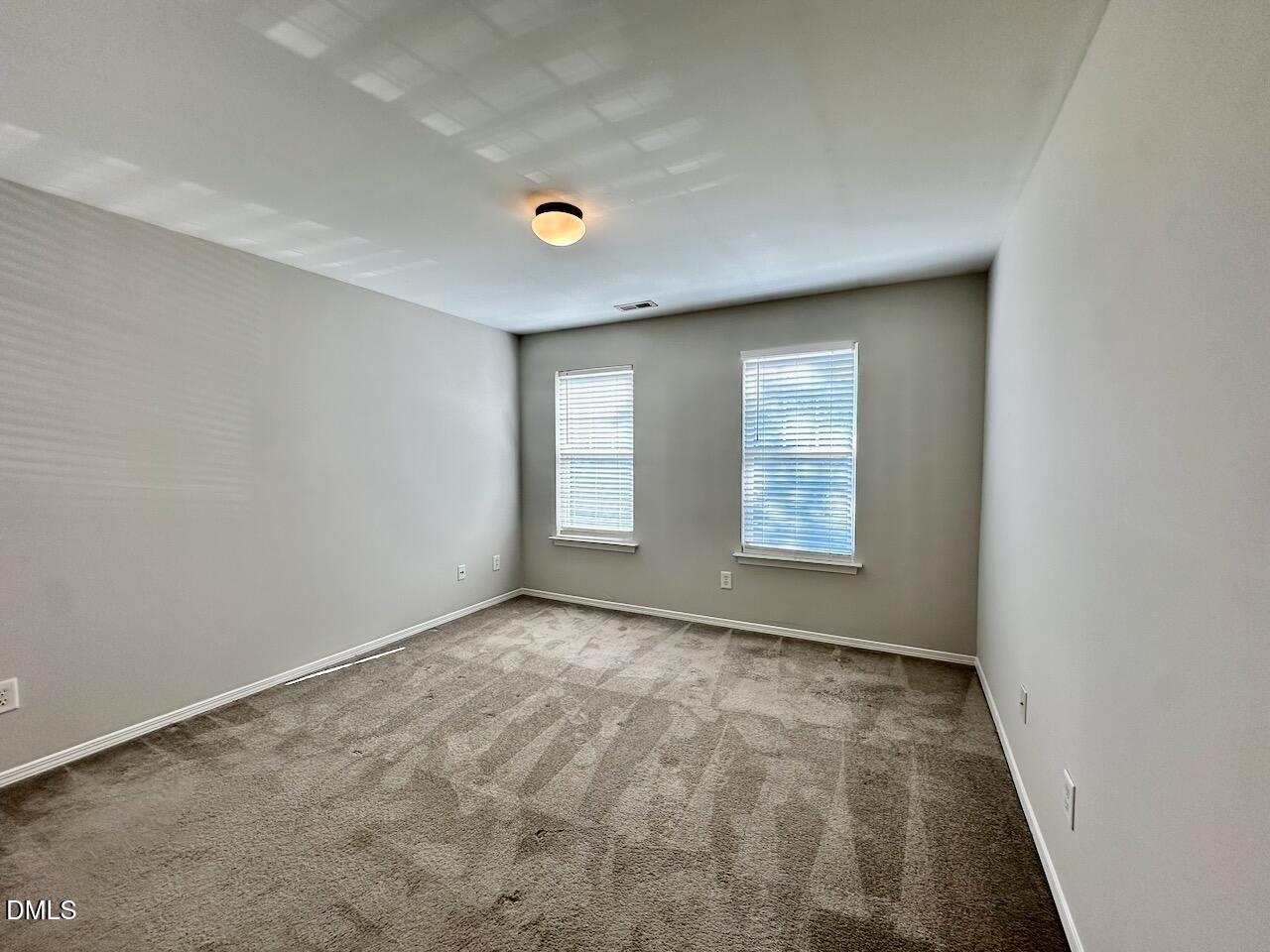 8208 Stone Cellar Drive Raleigh, NC 27613 - Photo 27 of 34 an empty room with windows