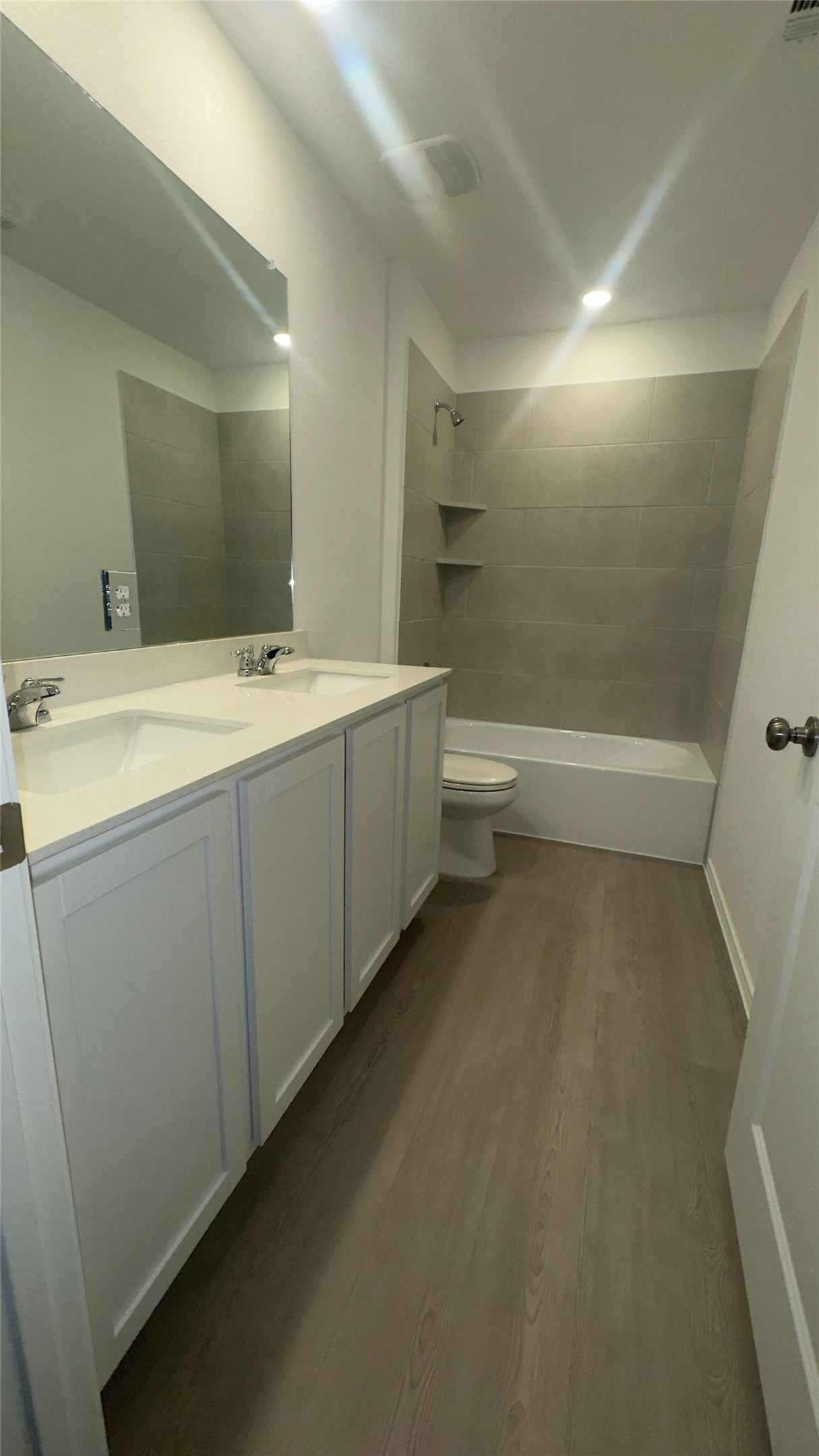 1541 Boggy Crk Rnch Road Georgetown, TX 78628 - Photo 20 of 30 Full bathroom featuring shower / tub combination, double vanity, and dark wood-type flooring