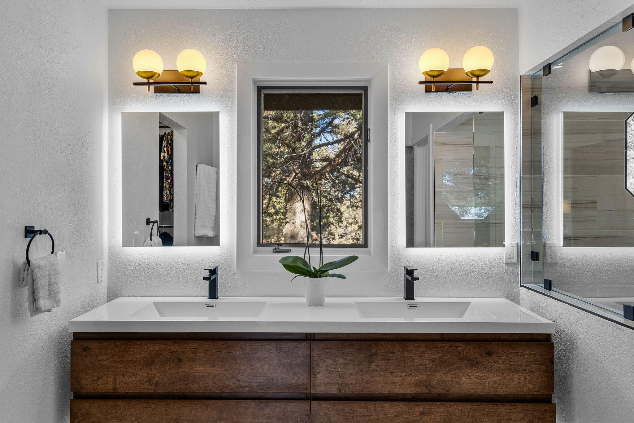 60340 Arnold Market Road Bend, OR 97702 - Photo 13 of 55 Double vanities and a walk-in closet out of view. Note the back-lit mirrors for the perfect prep.