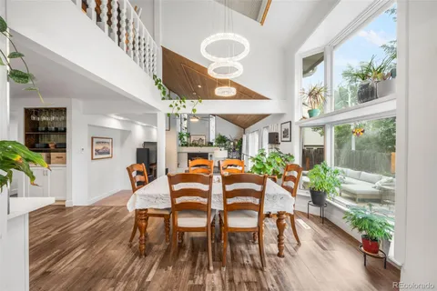 a living room with furniture and large windows