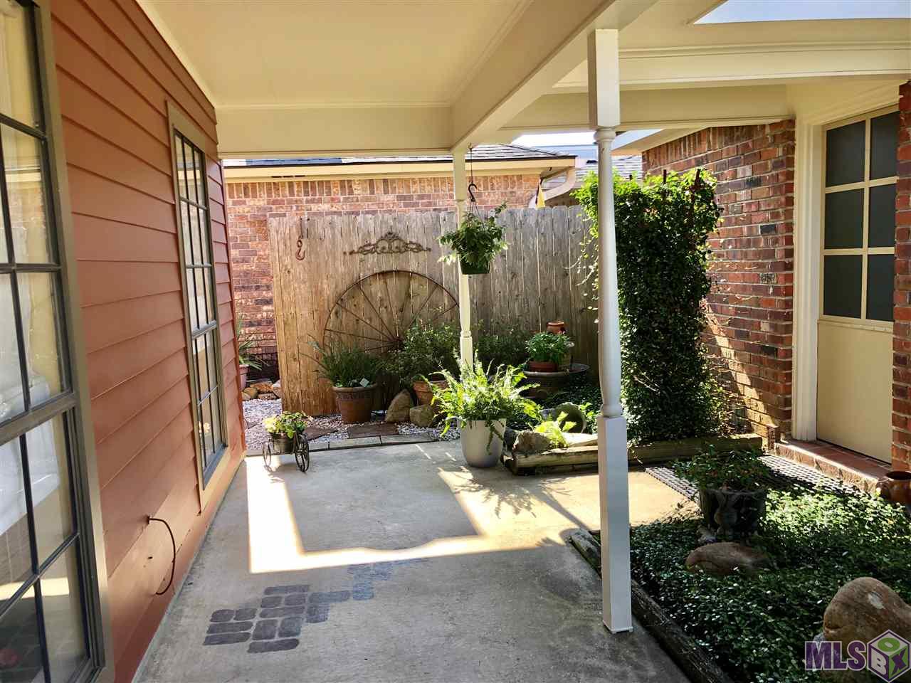 15433 Springwood Avenue Baton Rouge, LA 70817 - Photo 3 of 24 Large Front Porch that wraps around side of home