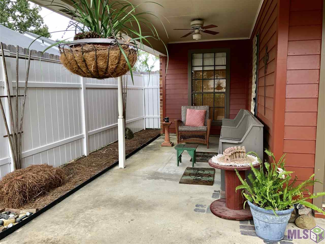 15433 Springwood Avenue Baton Rouge, LA 70817 - Photo 5 of 24 Side Porch that wraps around from front porch