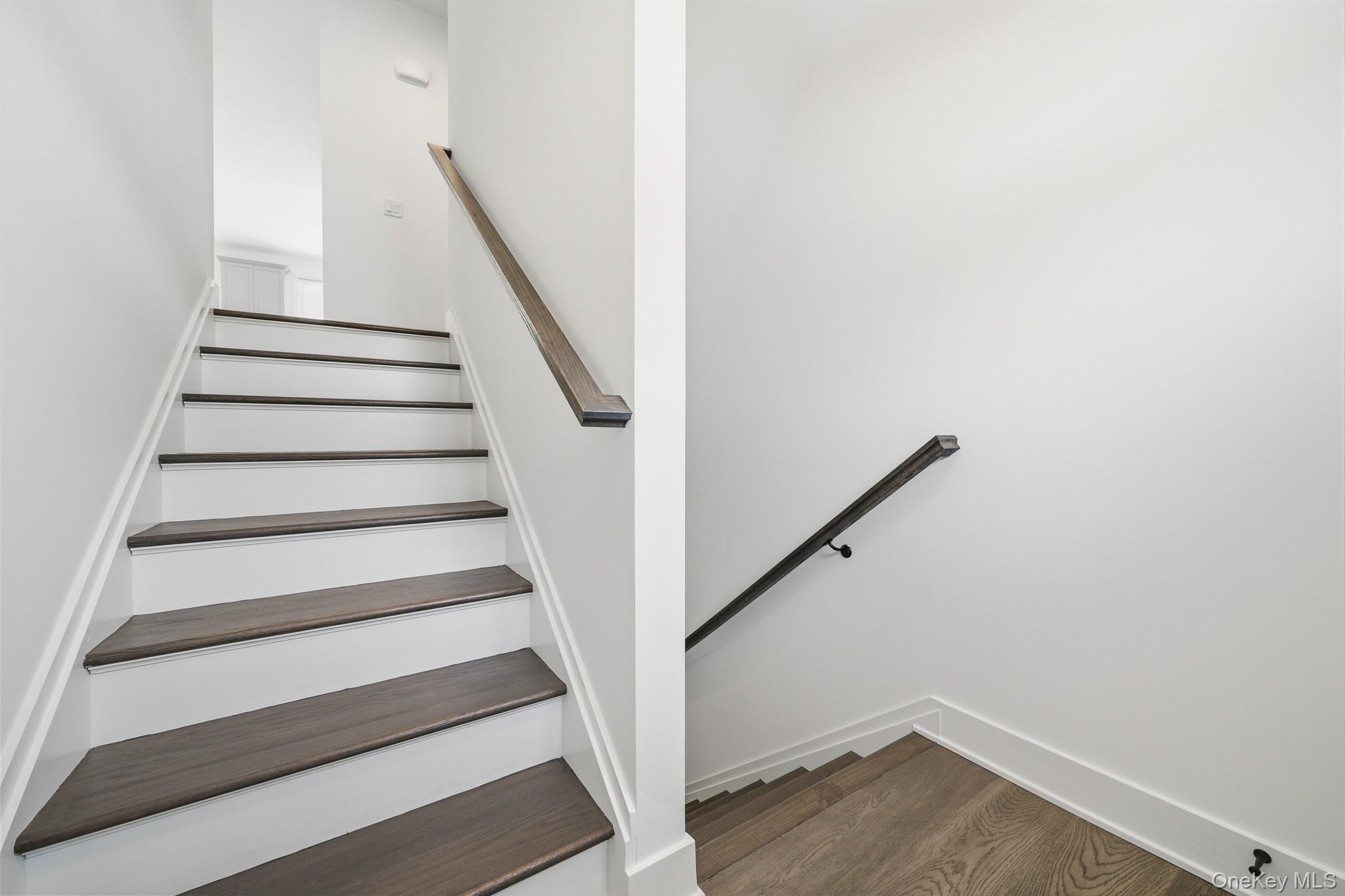 4034 Chestnut Rdg Road, Unit 62 Fishkill, NY 12524 - Photo 13 of 31 Stairway featuring wood finished floors and baseboards